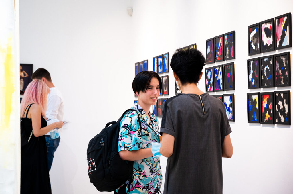 visitors-studying-the-72-small-scale-rosary-paintingsvisitors-studying-the-72-small-scale-rosary-paintings