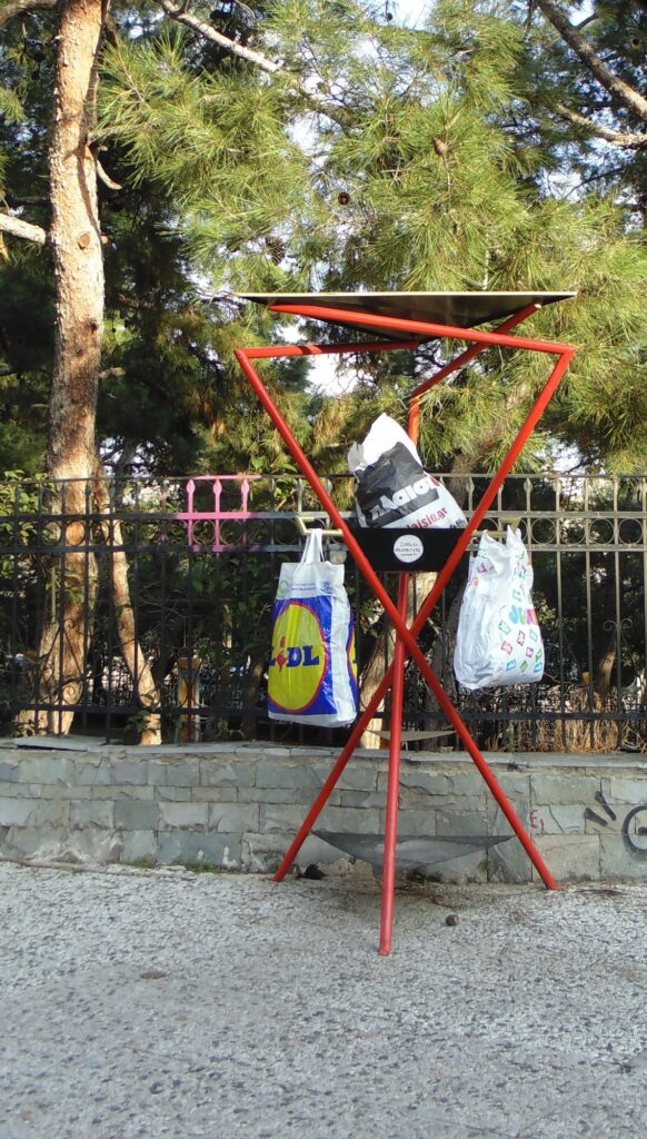 Hangers of the Public Space in use, with goods left for exchange