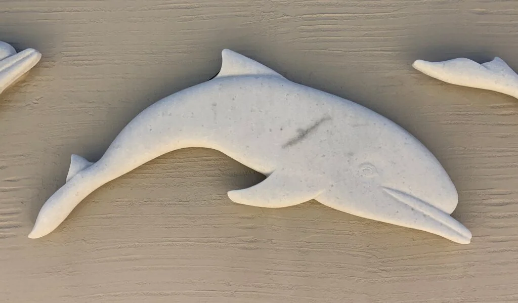 Detail of a marble dolphin relief, Kouros Art Hotel, Naxos, 2016